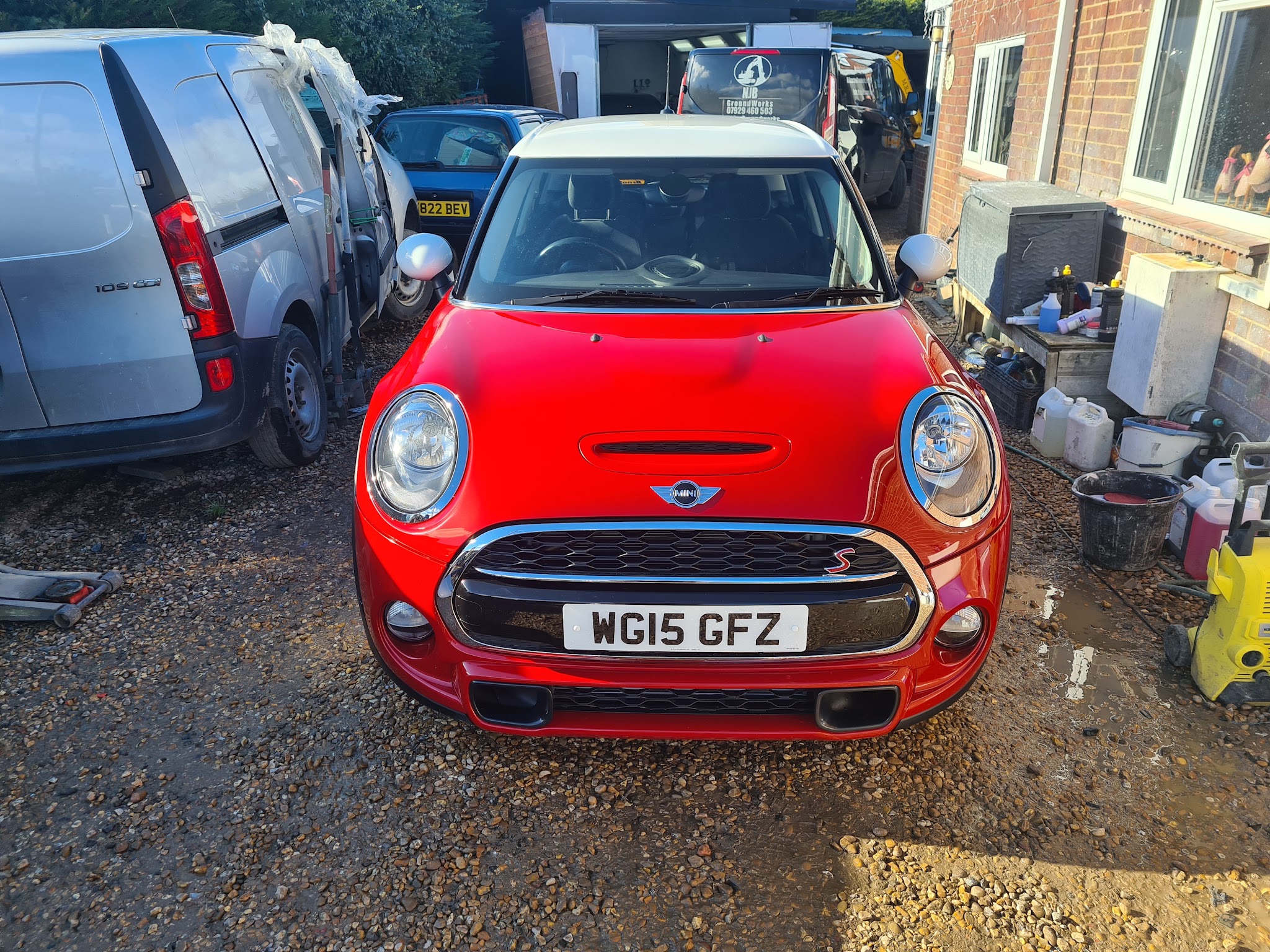 Red Mini Cooper S in the yard at The Lutton Bodyshop